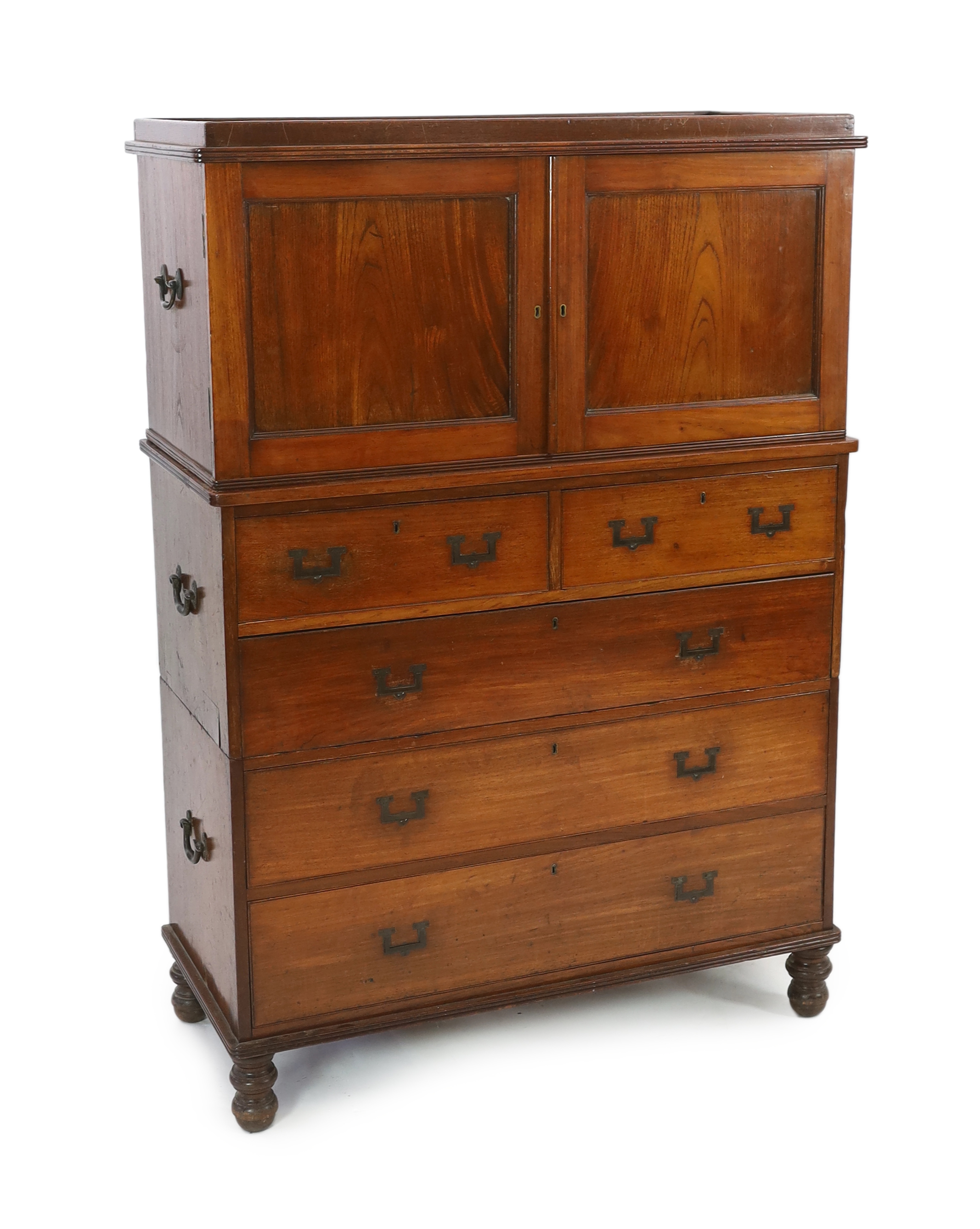 A Victorian teak campaign chest with press cupboard